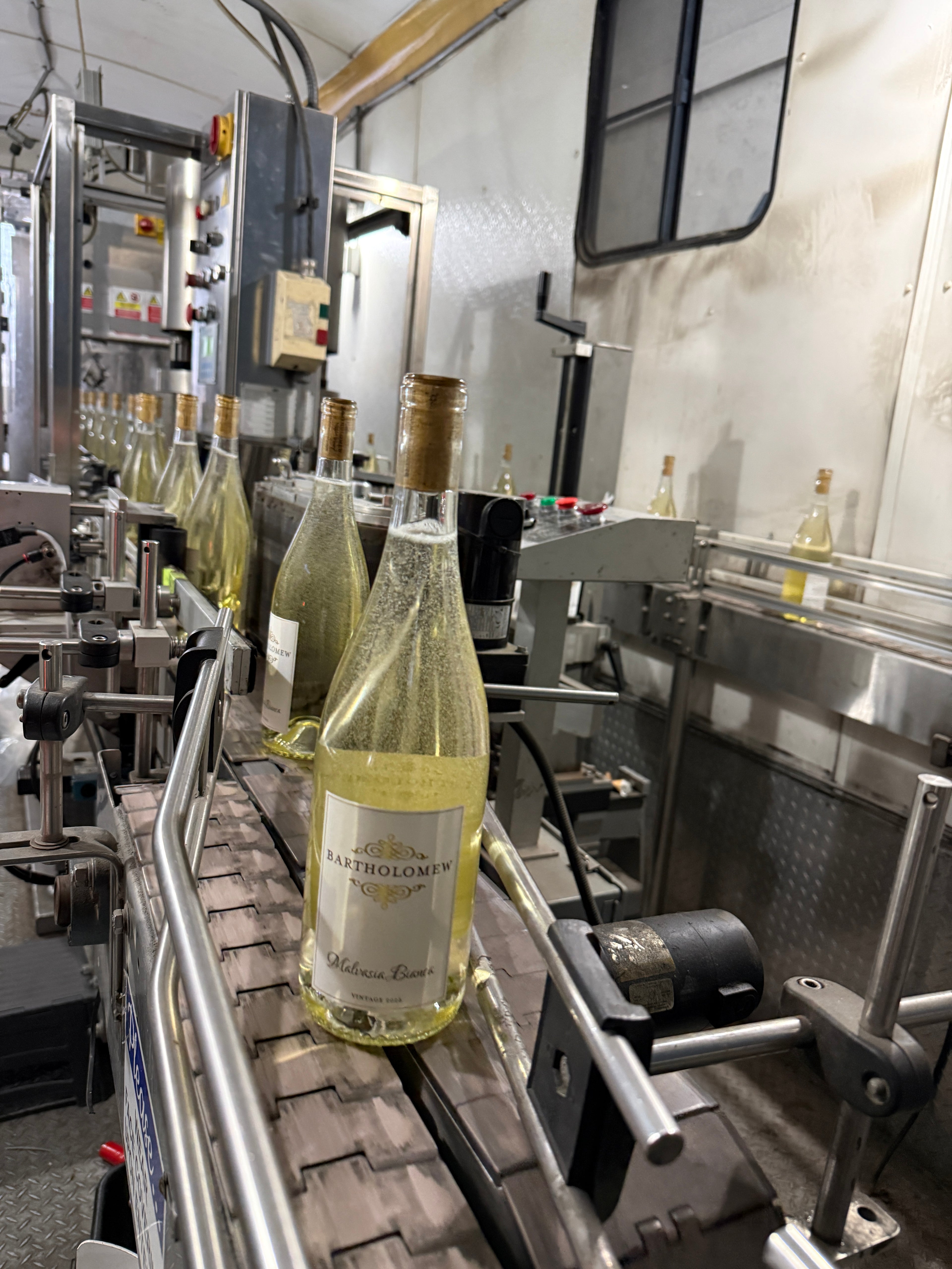 Bottles being processed on an industrial conveyor system